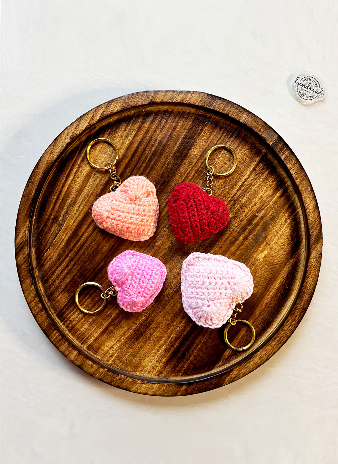 Our heart shaped stuffed keychains are tiny tokens packed with big feelings! Cute, lightweight, and full of personality, these plush heart keychains add playful charm to your keys, bags, or zipper pulls. Handcrafted with soft fabrics in vibrant colors or minimalist styles, each stuffed heart keychain carries warmth and style wherever you go. Perfect gift keychains for besties, loved ones, or anyone who loves keeping a little affection close.