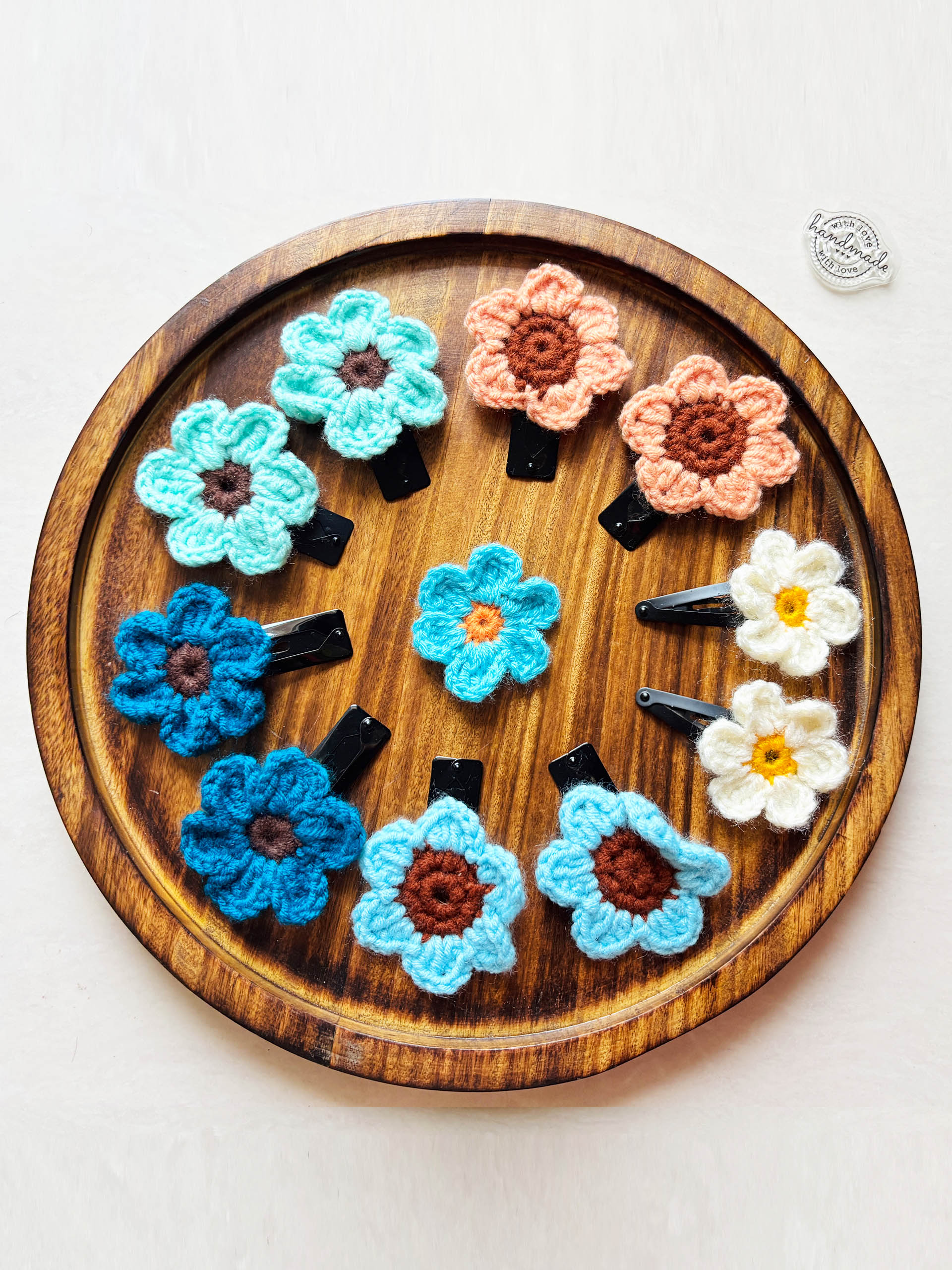 Bloomy Bliss Hairclips - Meet your new everyday favorite! These handcrafted crochet flower clips bring together soft textures and cheerful colors in the sweetest way. Each bloom is carefully stitched by hand, turning simple yarn into a garden of wearable joy.